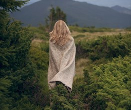 Woman wrapped in blanket in the Carpathian Mountain Range