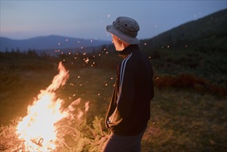 Man by campfire