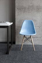 Blue chair by desk