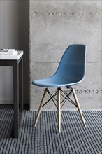 Blue chair by desk