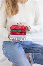 Woman holding Christmas fabrics