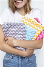 Woman holding colorful zigzag fabrics