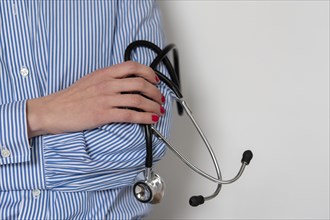 Doctor holding stethoscope