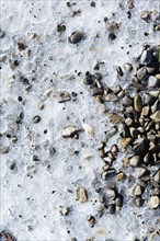 Ice over pebbles