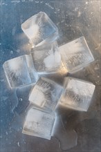 Ice cubes on silver surface