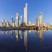 Skyline reflected in sea in Kuwait City, Kuwait