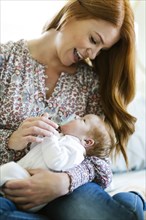 Woman holding her newborn son