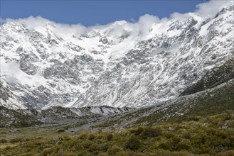 Cloud over snowcapped mountains in Mount Cook National Park, New Zealand