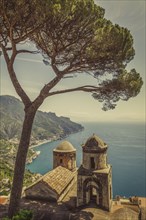 Tree over bell towers of Villa Rufolo in Ravello, Amalfi Coast, Italy