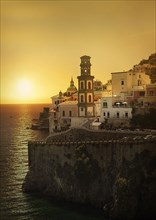 Bell tower by sea at sunset in Atrani, Italy