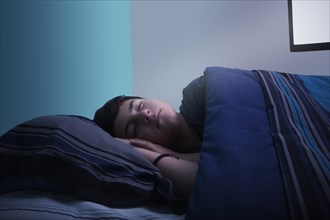 Boy sleeping in bed