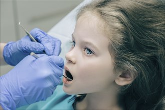 Girl during dentist examination