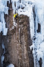 Man ice climbing in Ouray, USA