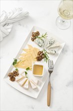 Cheese plate by glass of white wine