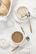 Two types of soup with bread