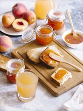 Apricot jam on toast with peaches and juice