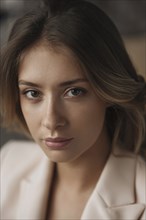 Portrait of young woman wearing natural make-up