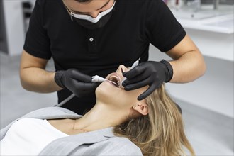 Dentist examining patient