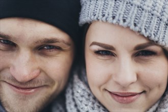 Portrait of young couple wearing woolly hats