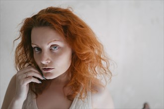 Portrait of redhead young woman