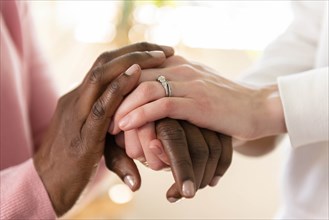 Nurse holding hands of patient