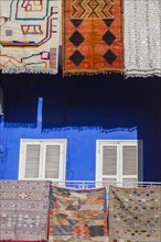 Rugs hanging from balconies in Marrakesh, Morocco