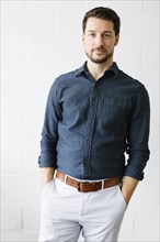 Mid adult man wearing blue button down shirt
