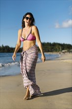 Woman in sarong at beach