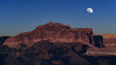 Moon over rock formation in Capitol Reef National Park, USA