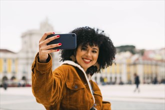 Young woman taking selfie in Lisbon, Portugal