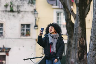 Young woman taking selfie in Lisbon, Portugal