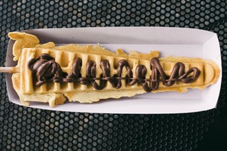 Waffle on stick with chocolate