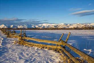Wooden fence and snow field in Picabo, Idaho