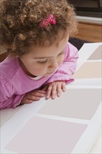 Girl looking at paint swatches