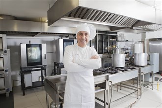 Chef smiling in commercial kitchen