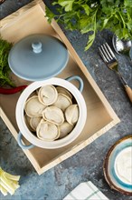 Pot of dumplings on tray