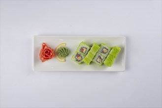 Plate of sushi with pickled ginger and wasabi