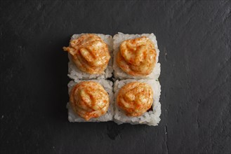 Sushi with orange sauce