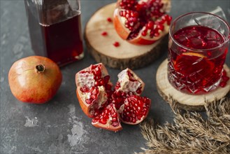 Pomegranates with glass of juice