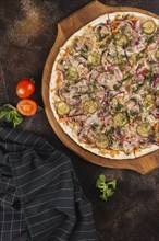 Pizza with pickles and red onion