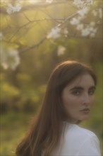 Young woman looking over her shoulder