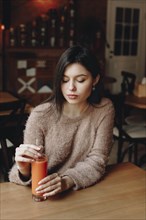 Young woman with carrot juice