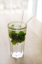 Cocktail with mint leaves and lemon