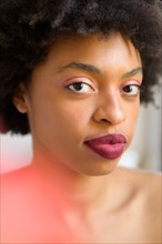 Portrait of young woman wearing lipstick