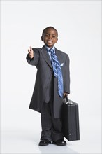 Boy dressed as businessman