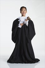 Teenage girl dressed as judge
