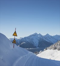 Warning signs on ski track in Piedmont, Italy