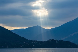 Sunbeams through clouds over Lake Como, Italy