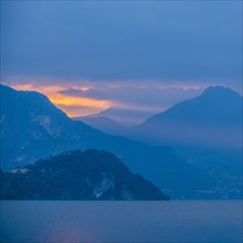 Sunset sky over mountains by Lake Como, Italy