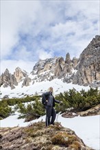 Woman hiking on Giau Pass in Dolomites, Italy